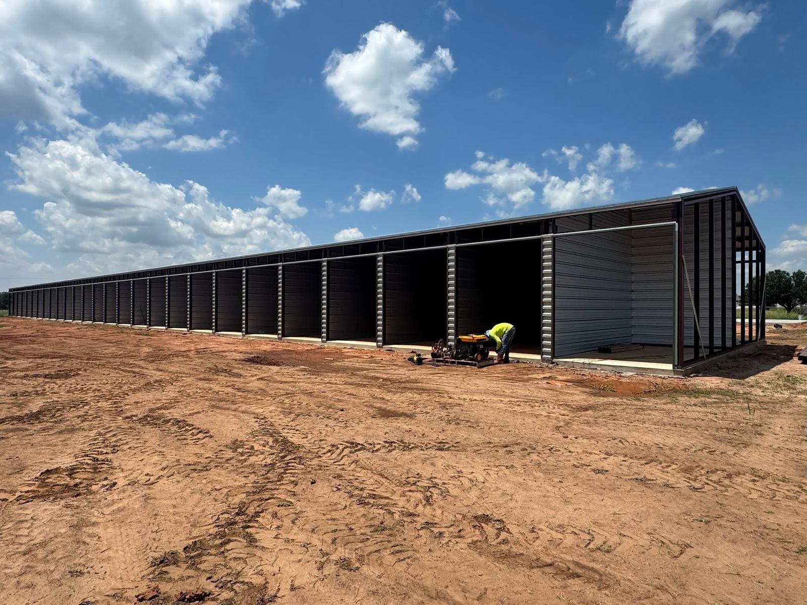 Long steel building framed with bays open during construction